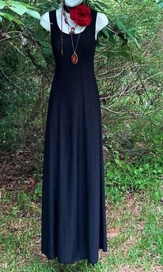 Black witchy Dress A beautiful vintage black maxi dress Empire line with long floaty skirt Stretchy polyester Sleeveless Size approx a xs Bust best fits busts of 32-34 inches High waist 26 inches Length Shoulder to hem- 60 inches Bohemian A-line Maxi Dress For Evening, Black Gothic Maxi Dress For Summer, Gothic Maxi Dress For Party, Black Sleeveless Gothic Maxi Dress, Fitted Gothic Maxi Dress, Fitted Gothic Floor-length Maxi Dress, Black Bohemian Maxi Dress For Night Out, Black Bohemian Evening Maxi Dress, Black Bohemian Maxi Dress For Evening