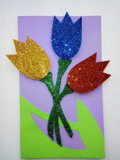 a card with glitter flowers on it