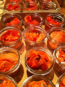 several jars filled with food sitting on top of a table