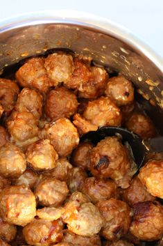 the meatballs are being cooked in the pot