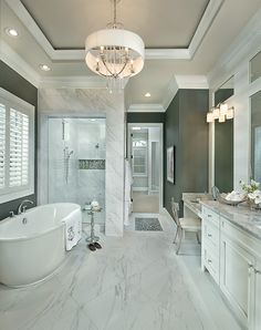 a large bathroom with two sinks and a bathtub