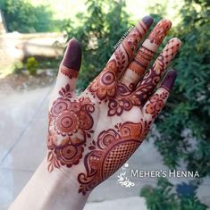 a hand with henna painted on it