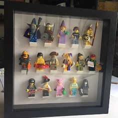 a shadow box with lego minifigures in it