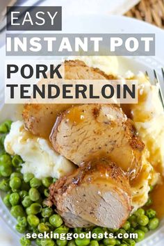 pork tenderloin with mashed potatoes, peas and gravy on a white plate