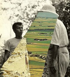 two men standing next to each other with a skateboard in their hands and one holding the board