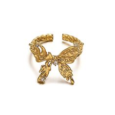 ✦ Indulge in the elegance of our Chunky 18K Gold Butterfly Cocktail Ring made with molten design and 18k gold plating. Perfect for any occasion, this statement ring features a bold butterfly design, adjustable fit, and serves as a luxurious gift for friends. Elevate your style with this exclusive piece that exudes sophistication and uniqueness. ----------- DETAILS ----------- - Color: Gold - Ring Size: 17.3mm (Approximately to Size US7) - Width: 1.8cm - Materials: 18K Gold Plated, Cubic Zirconia Adjustable Gold Butterfly Open Ring, Adjustable Yellow Gold Butterfly Ring, Elegant Adjustable Gold Butterfly Ring, Luxury Gold Butterfly Ring, Adjustable Gold Butterfly Ring, Luxury Gold Butterfly Ring As Gift, Luxury Gold Butterfly-shaped Ring, Cocktail Rings Statement, Butterfly Cocktail