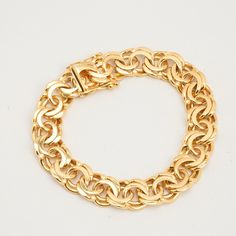 B I S M A R C K ∙ B R A C E L E T  ∙  * Details: Solid Gold ∙ 18K Gold ∙ Yellow Gold * Weight: 53.5 grams * Bracelet length: 7.68 inches // 19.5 cm * Width: 11 mm. * Condition: All our pieces are vintage, antique or close to new. The piece undergoes a restoration proces, which includes ultrasonic cleaning and mild polish techniques to enhance the condition of the piece. * All our pieces are vintage and handpicked. We put a lot of effort into finding the most unique and beautiful items for you gu Classic Gold-plated Bracelet With Hallmark, Classic Chain Bracelet With Round Solid Links, Classic Round Chain Bracelet With Solid Links, Classic Hallmarked Gold-plated Bracelet, Classic Round Chain Bracelet With Polished Finish, Round Yellow Gold Bracelet Stamped 14k, Stamped 14k Yellow Gold Bracelet, 14k Stamped Yellow Gold Round Bracelet, Formal Chain Bracelet