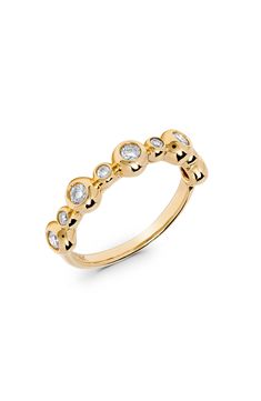 Bubbly bezel settings secure round-cut diamonds on this polished ring crafted from warm 14-karat gold. Total diamond weight: 0.41ct. Color: G–H Clarity: SI1 14k gold/diamond Made in the USA Diamond Guide Diamond Stacking Ring, Diamond Stacking Rings, Diamond Guide, Ring Crafts, Bezel Diamond, Stacking Ring, Stacking Rings, Bezel Setting, Round Cut Diamond