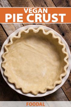 a pie crust in a white bowl on top of a wooden table with the title vegan pie crust