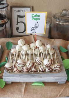 cake pops are lined up on a tray