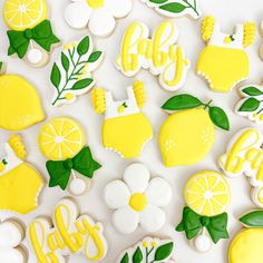 some decorated cookies with lemons and leaves on them