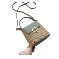 Marysol is style and beauty in all that is Spring Marysol is a sophisticated woven purse featuring a gold metal accent clasp and a crossbody adjustable strap. Its top handle is reinforced for added comfort and durability, making it perfect for pairing with a spring dress or casual jeans. This stylish and versatile bag is the perfect addition to your Spring wardrobe. We love the Mantis green color! Main Material: Faux (Vegan) Leather Lining Material: Polyester Hardware: Aluminum Alloy Number of H Trendy Beige Shoulder Bag For Spring, Spring Everyday Bucket Bag With Adjustable Strap, Everyday Spring Bucket Bag With Adjustable Strap, Trendy Summer Shoulder Bag, Spring Beige Straw Bag With Adjustable Strap, Beige Straw Bag With Adjustable Strap For Spring, Spring Crossbody Bucket Bag For Everyday Use, Straw Bag With Gold-tone Hardware For Everyday, Versatile Summer Crossbody Shoulder Bag