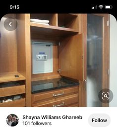 a wooden closet with drawers and an electronic device