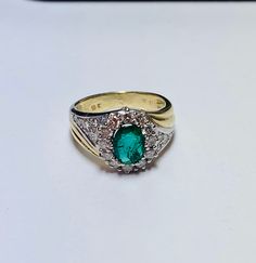 Beautiful Vintage 14k Yellow Gold Natural Oval Shape Emerald Ring 100% Natural Emeralds Emerald(s) 1.00CT Diamond: 0.80CT Color: G Clarity: SI1 Total ring weight: 5.2GR Ring sizing available free of charge For more information regarding this item feel free to reach me so I can accommodate your needs. Thank you Exquisite Oval Emerald Ring In Yellow Gold, Elegant Oval Emerald Ring In Yellow Gold, Elegant Yellow Gold Oval Emerald Ring, Oval Emerald Ring In Yellow Gold With Halo Setting, Oval Emerald Cluster Ring For Formal Occasions, Classic Oval Signet Ring With Center Stone, Classic Oval Emerald Ring With Center Stone, Exquisite Oval Diamond Ring With 17 Jewels, Oval Yellow Gold Emerald Ring For Formal Events