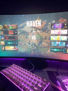 a computer keyboard and mouse on a desk in front of a large screen that says haven vs