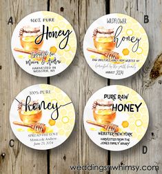 three beeswax honey labels on wooden planks with the words honey written in cursive writing