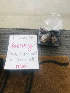 a sign sitting on top of a brown rug next to a bag of yarns