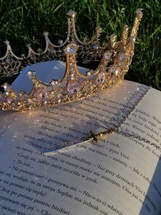 a tiara laying on top of an open book