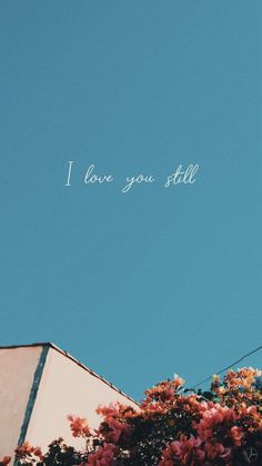 the words i love you still are written in white ink on a blue sky background