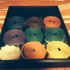 a box filled with lots of different colored ties