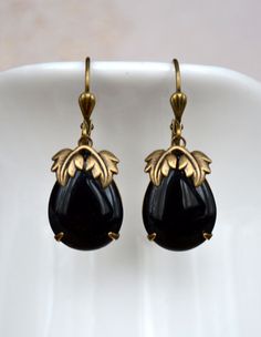 VINTAGE ELEMENTS Unique Jewellery, Handmade from Vintage Inspired Original Designs Fabulous Art Nouveau, Art Deco style antiqued Gold Brass Earrings with Jet Black Teardrop set glass stones and ornate leaf detail. These earrings are made with antiqued brass leverback earwires and measure 3.5cm from the top of the earwires.