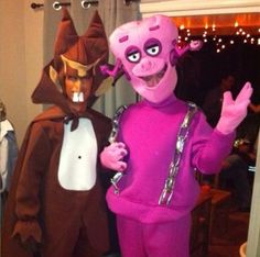 two people in costumes standing next to each other