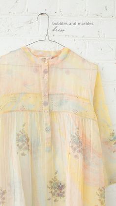 This classic mandarin collar tunic comes in cotton chanderi with stitch details of zari and buttoned placket in front. The subtle floral motifs and patterns of micro dots on pastel hues gives it a minimal and breezy look. Lilac Marble, Global Desi, Fashion Attire, Pastel Hues, Cut Work, Embroidery Details, Mandarin Collar