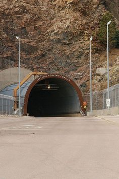 a large tunnel is shown in the middle of a mountain