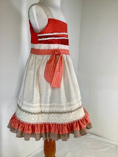 This  Moana inspired dress is made of cottons with lace trims.  It has a double ruffle at hem and the bodice is lined in broadcloth .   There is a back zipper and all seams are finished. This is a smoke free and pet free environment. SIZE    WAIST    LENGTH   3T ---   22" ----  22"  4T ---   23" ----  23"  5 ----   24"  ----  24.5"  6 ---- 24.5" ----  25.5" Cotton Dress With Ruffled Straps And Lining, Summer Cotton Prairie Dress With Ruffles, Ruffled Sundress For Dress-up Occasions, Sundress With Ruffles For Dress-up Occasions, Fitted Cotton Sundress For Dress-up, Fitted Cotton Sundress For Dress-up Occasions, Fitted Cotton Sundress With Ruffles, Fitted Sleeveless Cotton Ruffle Dress, Sleeveless Fitted Cotton Ruffle Dress