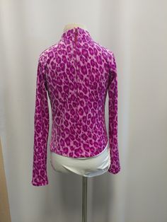 "We are so excited for this new shirt but we have limited stock! Sparkly glitter and fun leopard print will surely set you apart from the crowd! Available in Fuchsia and Lime Green. Shirt stretches for extra comfort and fit. Zip back and our signature attached brief with velcro closure to stay tucked in. Merchandise is shipped within 1 to 3 weeks. If a rush order is needed , message us here, or e-mail us at gloria [!at] rodeoqueenshirts.com to check availability. We try to keep 1 of every shirt Leopard Print Stretch Tops For Spring, Spring Leopard Print Stretch Top, Spring Stretch Leopard Print Tops, Pink Fitted Shirt For Fall, Party Tops With Stretch And Printed Details, Party Tops With Printed Stretch Fabric, Stretch Printed Tops For Party, Stretch Leopard Print Tops For Fall, Trendy Long Sleeve Leopard Print Top