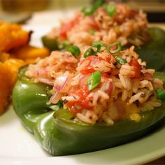 green peppers with rice and vegetables on a plate