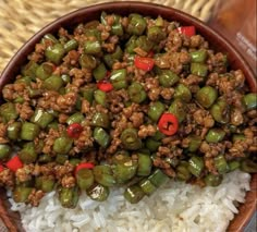 a bowl filled with rice and green beans