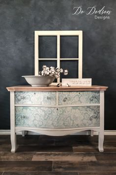 an old dresser with a bowl on top