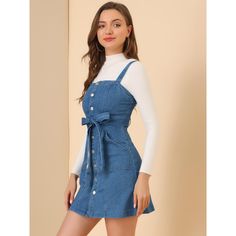 Update your weekend collection with this classic denim dress. The fit and flare dress structure adds a playfulness to your outfits and the button detailing gives a 60s-inspired feel. This jean dress features a square neck, sleeveless design, and adjustable strap. Perfect for the weekend, and paired well with trainers and a cross-body bag for an off-duty look. A-line Mini Dress With Button Closure, Retro Mini Dress With Button Closure, Trendy Denim Blue Mini Dress With Buttons, Retro Mini Dress With Button Closure For Spring, Denim Blue Buttoned Mini Dress For Day Out, Retro Denim Dress With Buttons For Spring, Retro Spring Denim Dress With Buttons, Retro Buttoned Denim Dress For Spring, Trendy Cotton Dress With Button Closure