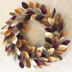 a wreath made out of different colored leaves