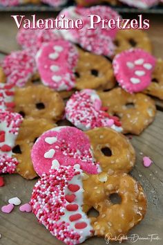 valentine pretzels with pink and white sprinkles are on a wooden table