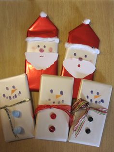 christmas presents are wrapped in white paper and decorated with santa hats, snowmen, and noses