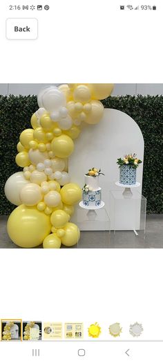 an image of balloons on the wall and in the background, there is a cake