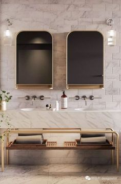 a bathroom with double sinks and two mirrors