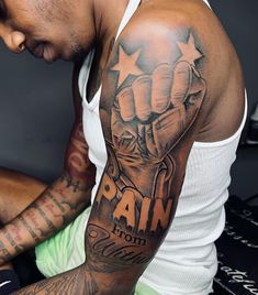 a man with a tattoo on his arm