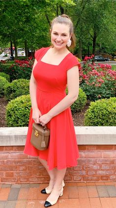 Gal Meets Glam Regina Dress. This dress makes me feel like a movie star! the skirt twirls! I also love the red color. There is nothing like a red dress to make you feel glamorous. Plus it is retro and has such a great square neck. I love it so much I can't wait to go dancing and twirl the night away! #galmeetsglamcollection #reddress #markcross #benchleybag #tuckernucking #statementearrings