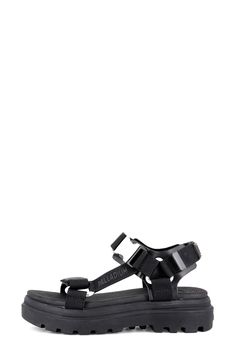 Enter the sunnier seasons in modern style with this platform sandal showcasing a sleek buckle strap and a grippy lugged sole for superior traction. 1 3/4" heel (size 7) Adjustable ankle strap with buckle and hook-and-loop closure Cushioned footbed Textile upper and lining/synthetic sole Imported Black Sandals With Buckle Closure For Outdoor, Black Sandals With Buckle Closure For Outdoor Activities, Black Buckle Closure Sandals For Outdoor, Outdoor Sport Sandals With Ankle Strap And Buckle Closure, Open Toe Sandals With Buckle Closure For Outdoor, Open Toe Sandals With Buckle Closure For Outdoor Activities, Black Sandals With Adjustable Strap For Outdoor, Black Sandals With Adjustable Strap For Outdoor Activities, Black Strap Sandals For Outdoor