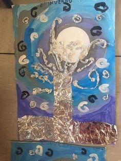 a piece of art that has been made to look like a tree with the moon in it