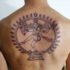 a man with a tattoo on his back