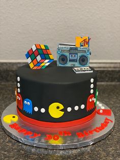 a birthday cake decorated with an image of a truck and some toys on top of it