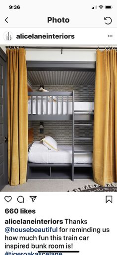 a bed room with two bunk beds next to each other and yellow drapes hanging from the ceiling