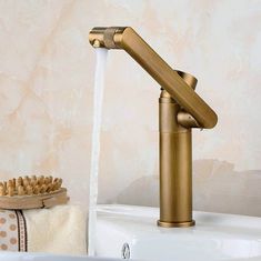 a gold faucet with water running from it