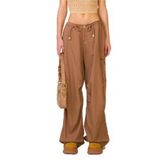 SMFK Compass Wild Viper Cargo Pants Khaki - Design: SMFK's wide-leg paratrooper pants designed in 2022, the 2024 version has increased the loose degree and is set as mid-low waist. - Care: Professional care and dry cleaning needed Size (in cm) Waist Hip Length XS 91 132 102 S 95 136 104 M 99 140 106 L 103 144 108 Materials: 100% Nylon Baggy Wide Leg Parachute Pants For Outdoor, Outdoor Wide Leg Bottoms For Fall, Techwear Style Wide Leg Parachute Pants With Cargo Pockets, Techwear Wide Leg Cargo Parachute Pants, Wide Leg Cargo Jeans For Outdoor Fall Activities, Fall Wide Leg Cargo Jeans For Outdoor, Brown Wide-leg Cargo Pants For Streetwear, Brown Baggy Wide Leg Parachute Pants, Baggy Wide Leg Cargo Pants For Outdoor