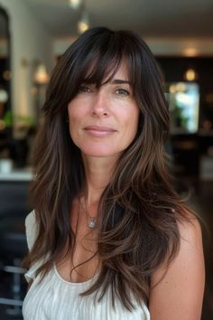 41 Pretty Long Layered Hair with Side Bangs Hairstyles For A Fresh New Look Long Hairstyles Bangs Layers, Women 40 Hairstyles, Blending Bangs Into Layers, Long Layered Brunette Hairstyles, Bangs Middle Age Women, Long Forehead Hairstyles, Long Brunette Hair With Bangs, Long Shaggy Layers, Lon Hair