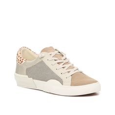 Dolce Vita-Zina Court Sneaker Head out in cool and confident style wearing the Zina Court shoe from Dolce Vita. Snakeskin embossment transforms the classic lace-up profile for an urbane look, while the leather lining and rubber outsole offer strolling comfort. Chic Beige Sneakers For Spring, Beige Perforated Sneakers For Spring, Spring Beige Perforated Sneakers, Cream Sneakers For Fall, Confident Style, Cute Sneakers, Trending Boots, Trending Sneakers, Athleisure Fashion